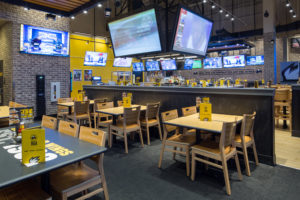 Buffalo Wild Wings LV Strip Location; Bar with 3 screen jumbotron over bar